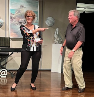 A woman pointing at a man